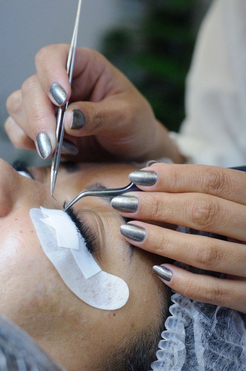 Lash extensions being applied