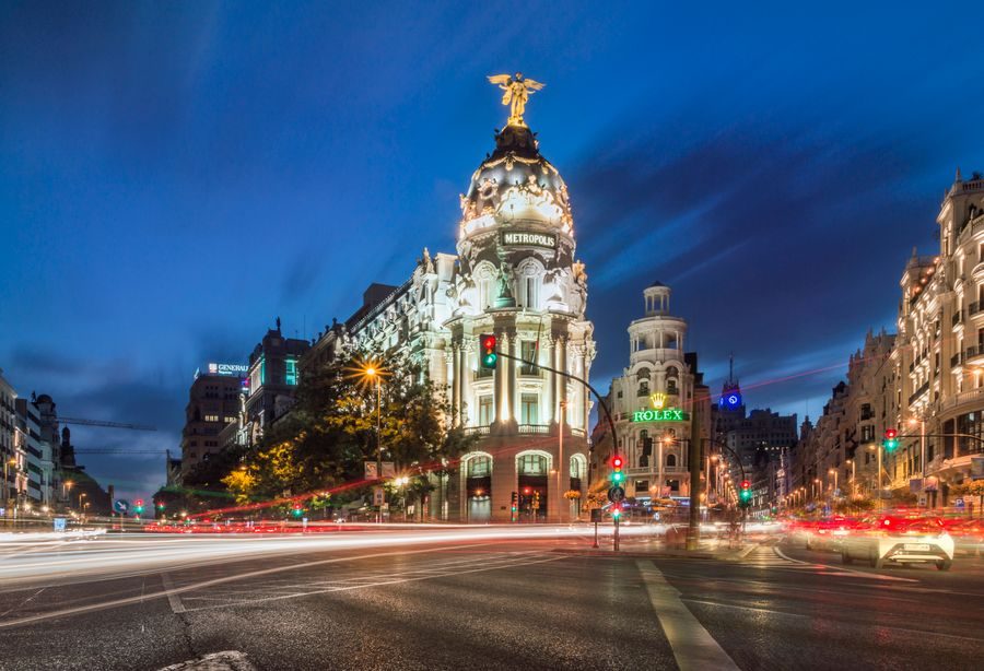 Gran Vía in Madrid at dusk with light trails