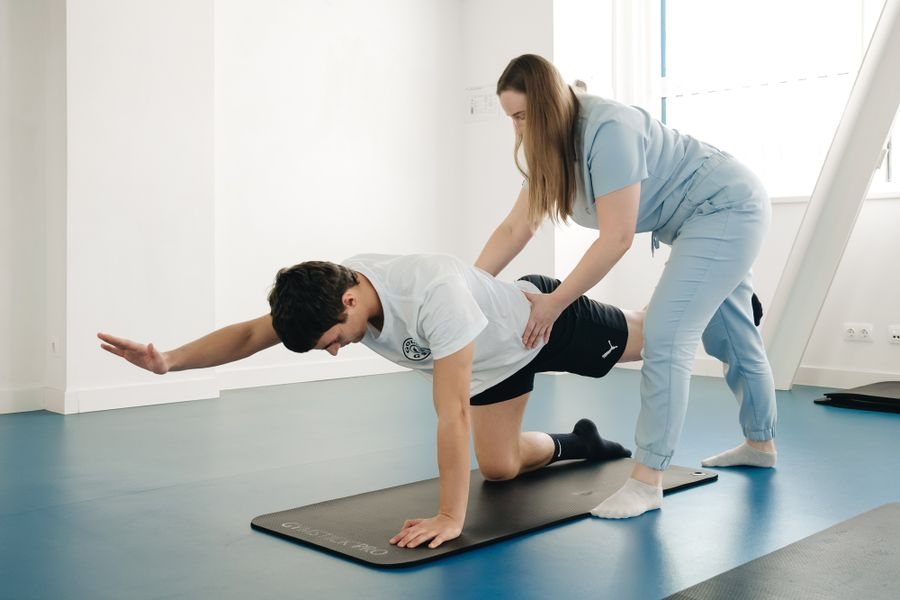 Physiotherapist guiding an exercise