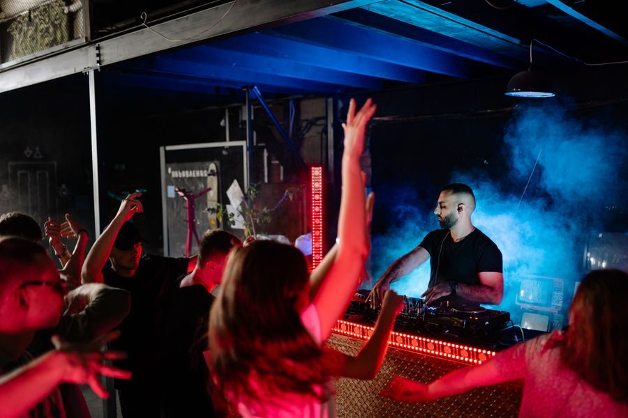 Guests dancing in front of the DJ booth
