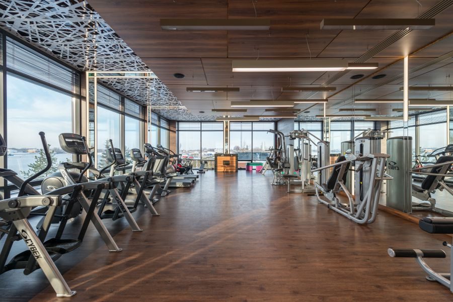 Sunlit gym floor with city views