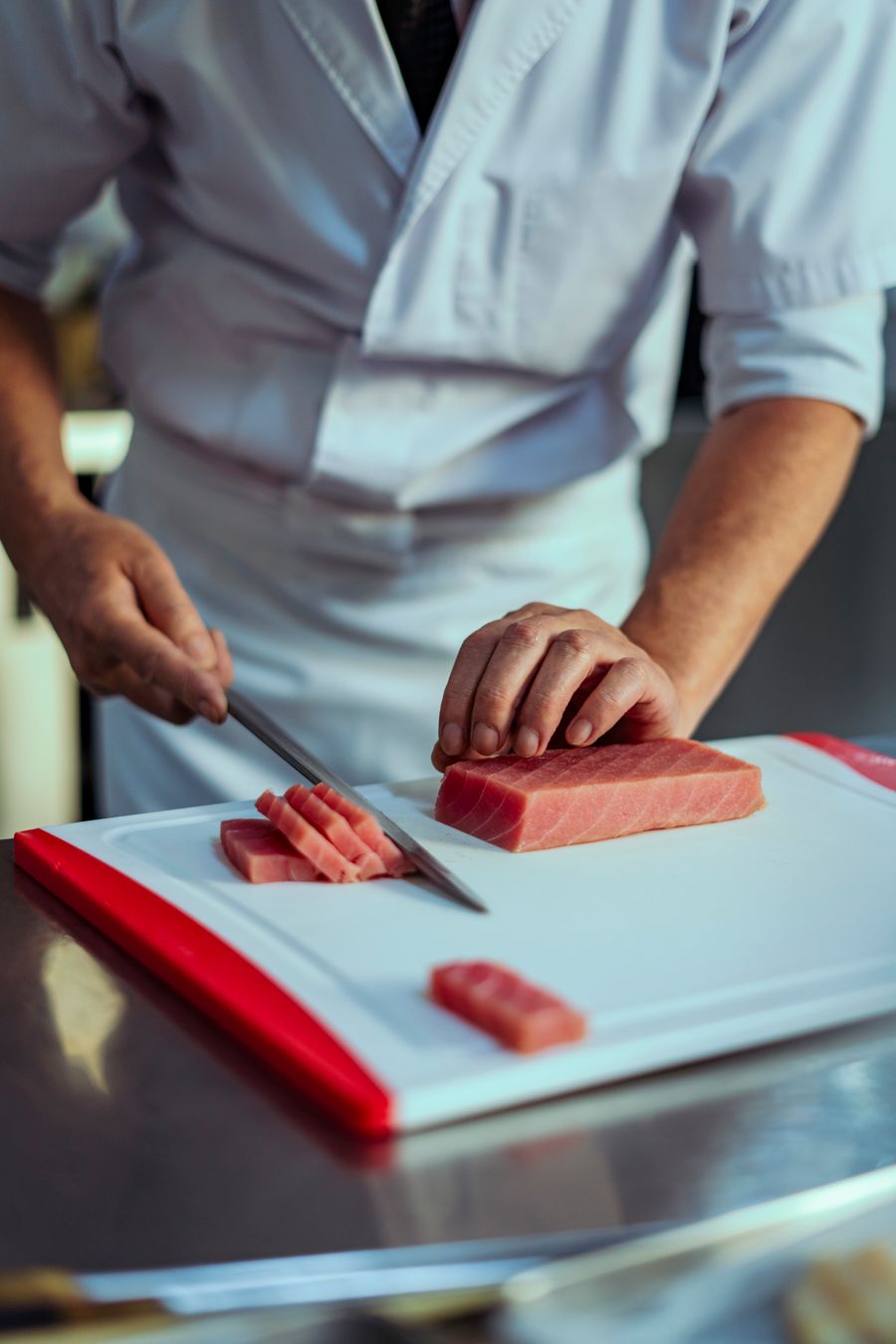 Chef breaking down a bluefin loin