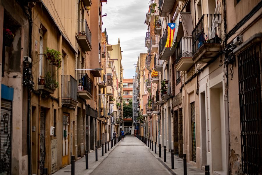 Narrow street with balconies in El Born, Barcelona
